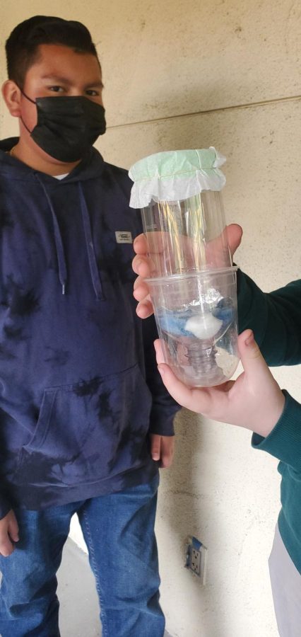 Students learn to make a water filter.
